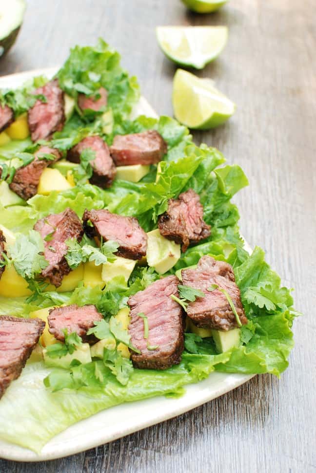 These steak lettuce wraps are fresh and light, yet filling too! Think healthy lettuce wraps made with tasty marinated beef, avocado, and mango. 