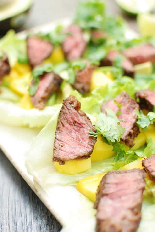 These steak lettuce wraps are fresh and light, yet filling too! Think healthy lettuce wraps made with tasty marinated beef, avocado, and mango. 