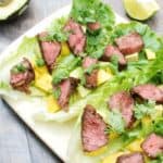 These steak lettuce wraps are fresh and light, yet filling too! Think healthy lettuce wraps made with tasty marinated beef, avocado, and mango.