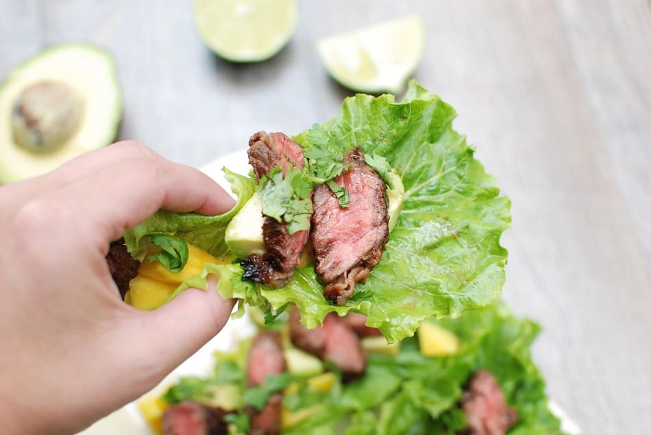 These steak lettuce wraps are fresh and light, yet filling too! Think healthy lettuce wraps made with tasty marinated beef, avocado, and mango. 