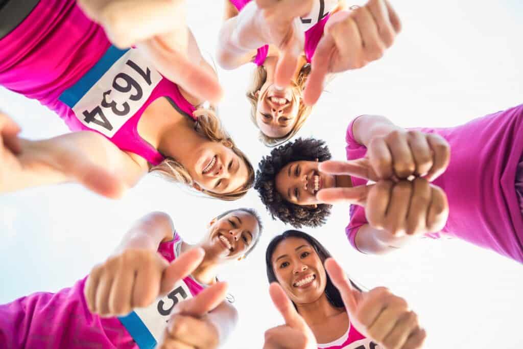 Women participating in a breast cancer fundraiser fitness event.