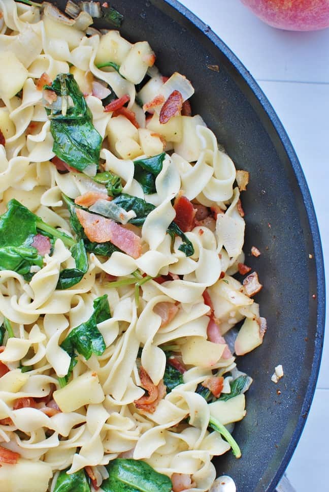 This easy noodle recipe is made with just seven ingredients, including noodles, bacon, apples and spinach. Super simple, super tasty!| 