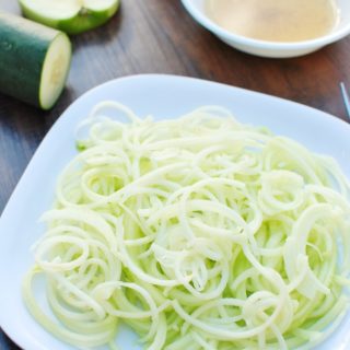 This spiralized apple and cucumber salad combines hydrating cucumbers alongside crisp, tart green apples, all tossed in a nutty pumpkin seed oil dressing.