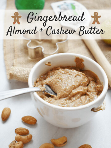 Homemade gingerbread almond cashew butter in a small cup with a spoon