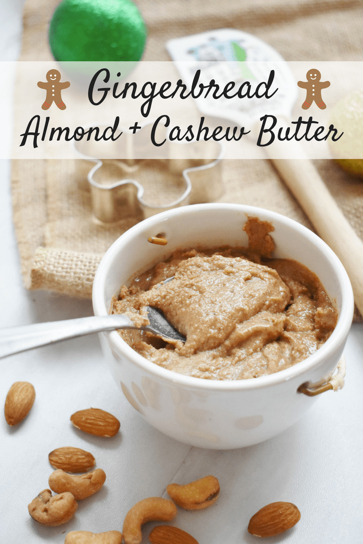 Homemade gingerbread almond cashew butter in a small cup with a spoon.