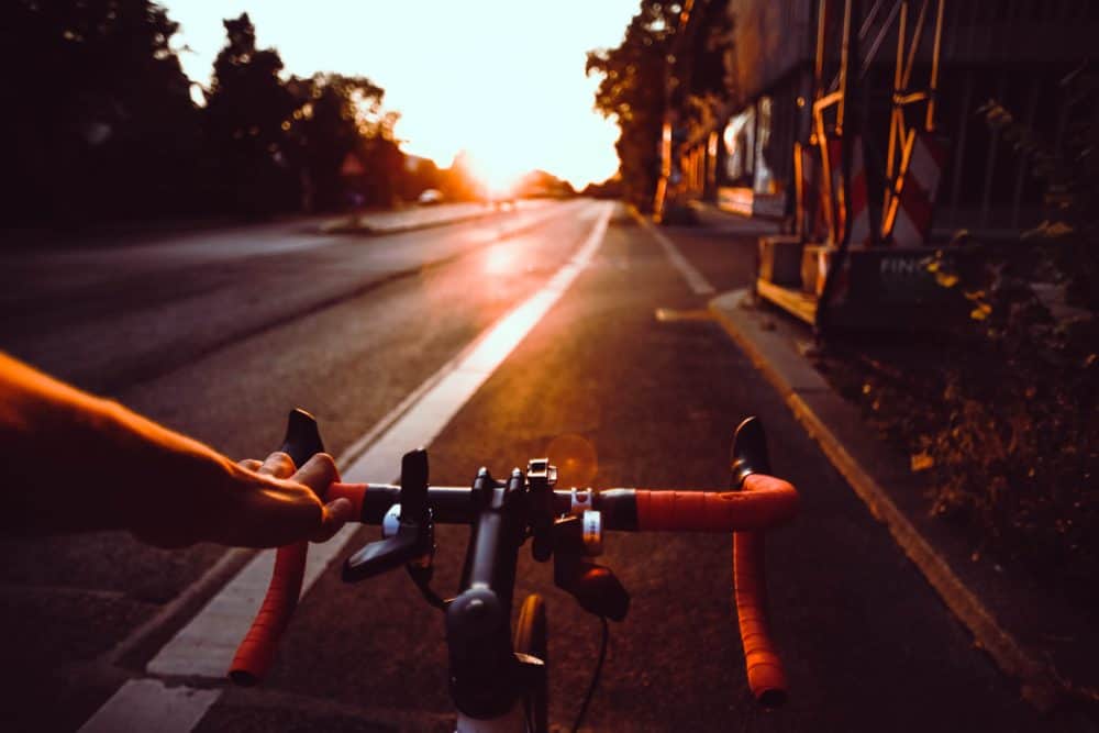 Bicycle on the road around sunset