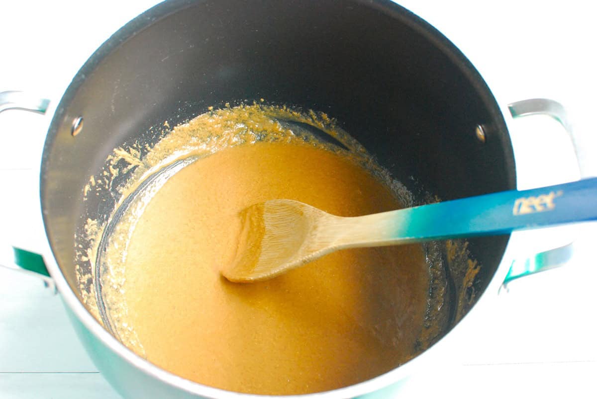 Peanut butter, honey, and coconut oil melted together in a large pot.