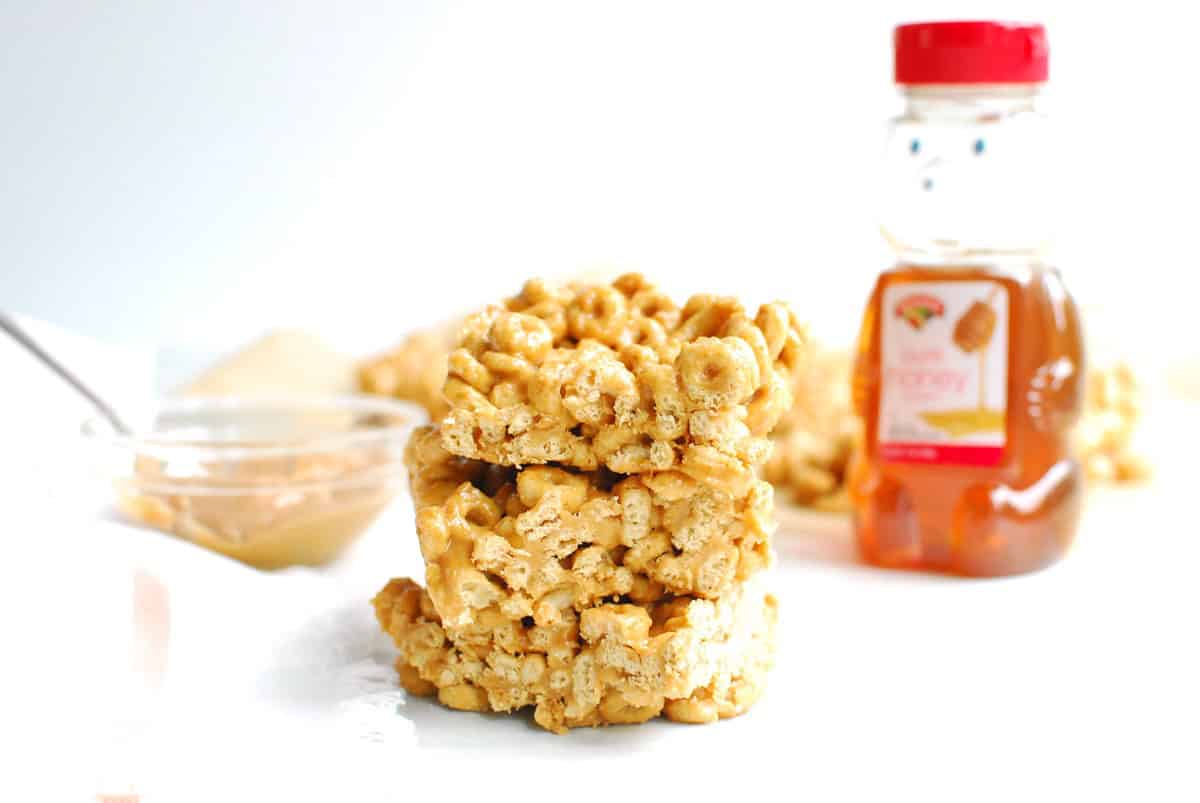 A stack of three honey peanut butter cheerios squares.