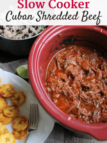 Cuban shredded beef in a slow cooker dish, with a text overlay
