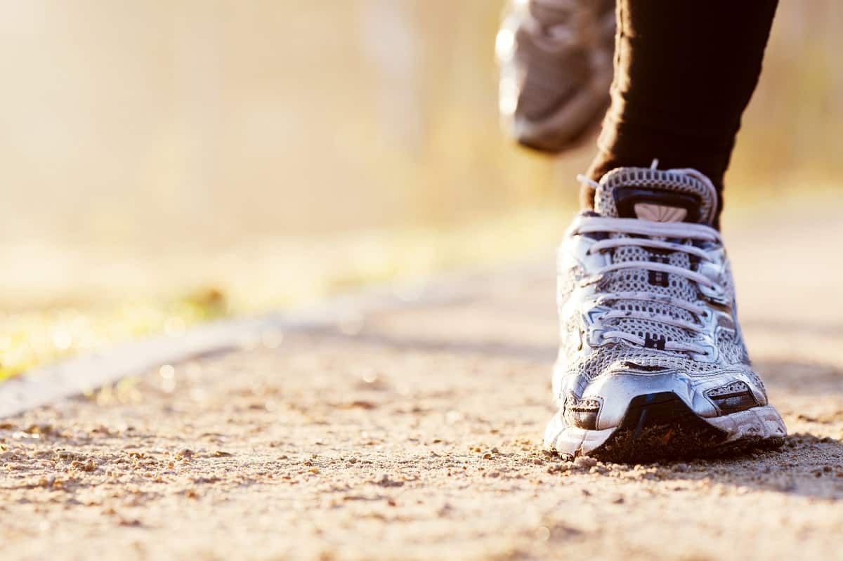 A runner's sneakers in action during a run.