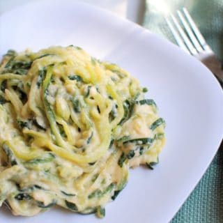 Zoodle mac and cheese on a white plate