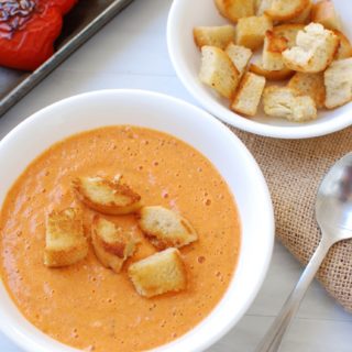 Bowl of Roasted Red Pepper and Gouda Soup topped with croutons