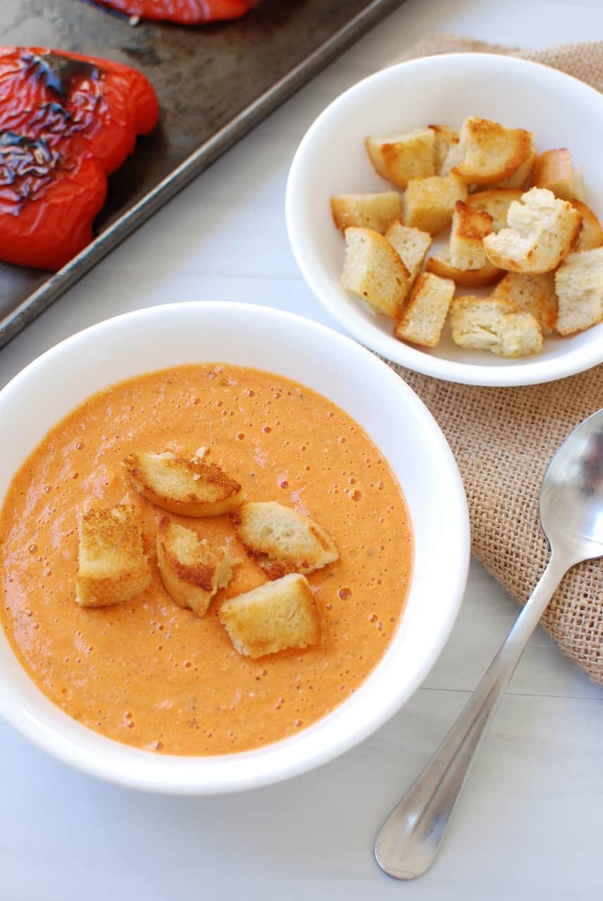 Bowl of Roasted Red Pepper and Gouda Soup topped with croutons