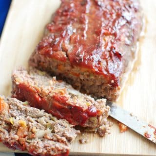 Green chile meatloaf on a cutting board