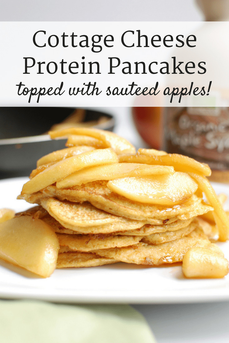 Cottage cheese protein pancakes topped with sautéed apples on a white plate.