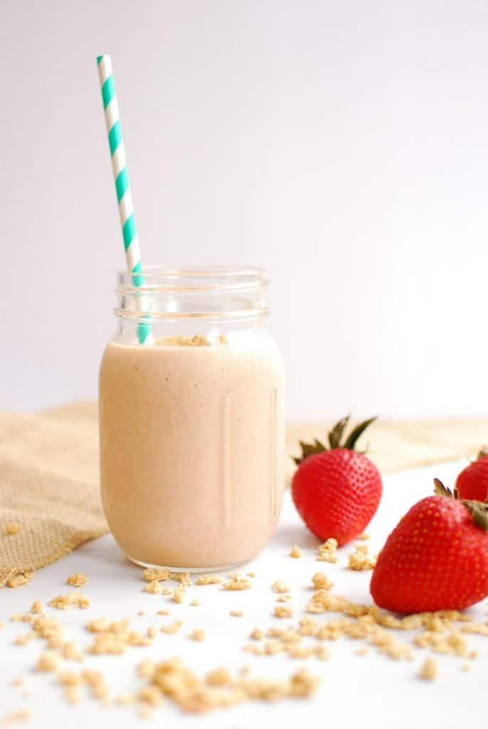 Granola Smoothie with Peaches and Strawberries Snacking in Sneakers