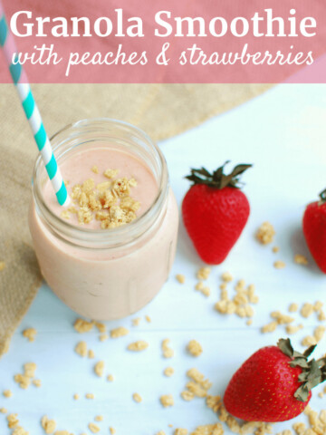 Granola Smoothie in a mason jar next to strawberries