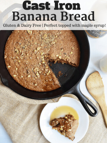 Cast iron banana bread in a skillet next to a plate and spoon