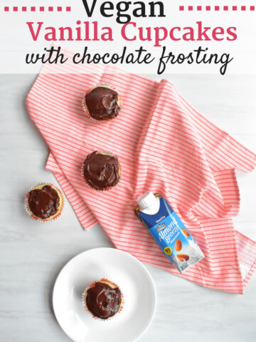 Vegan vanilla cupcakes topped with vegan chocolate frosting