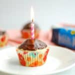 Vegan vanilla cupcake with a birthday candle