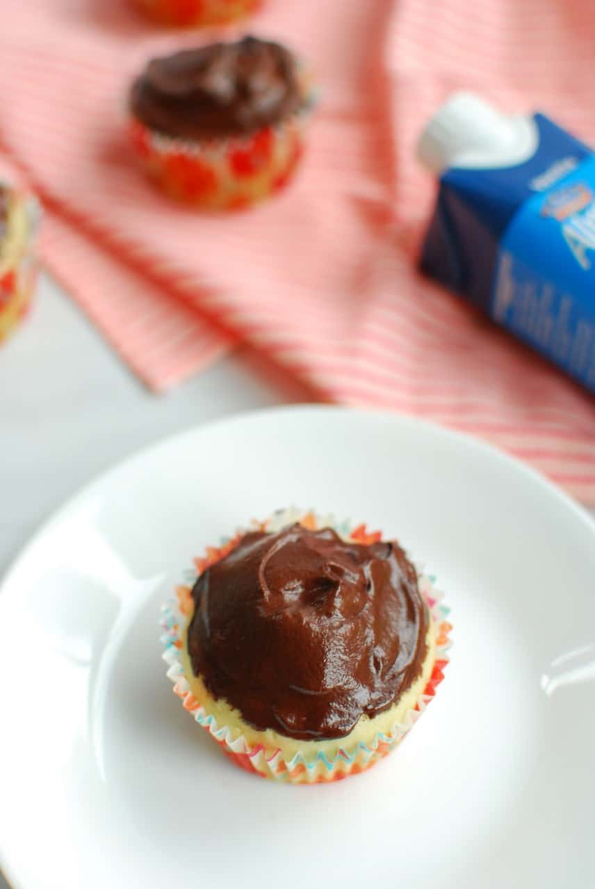 Rich vegan chocolate frosting on a vanilla cupcake