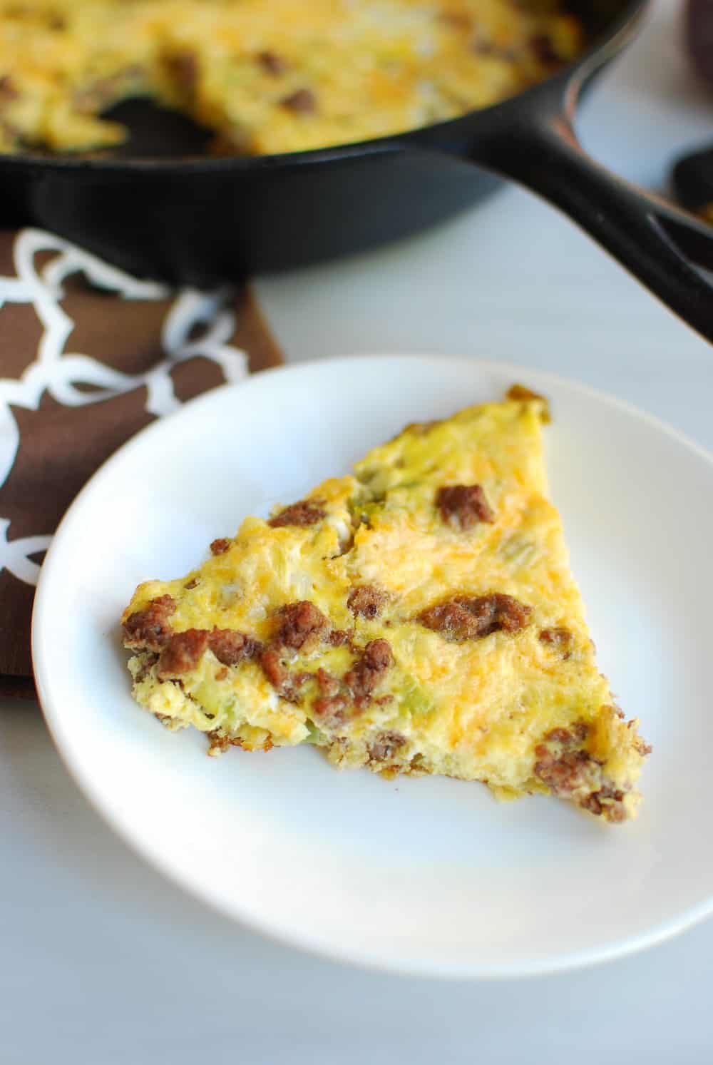 Slice of cheeseburger frittata on a plate