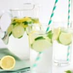 Glass full of infused cucumber lemon mint water