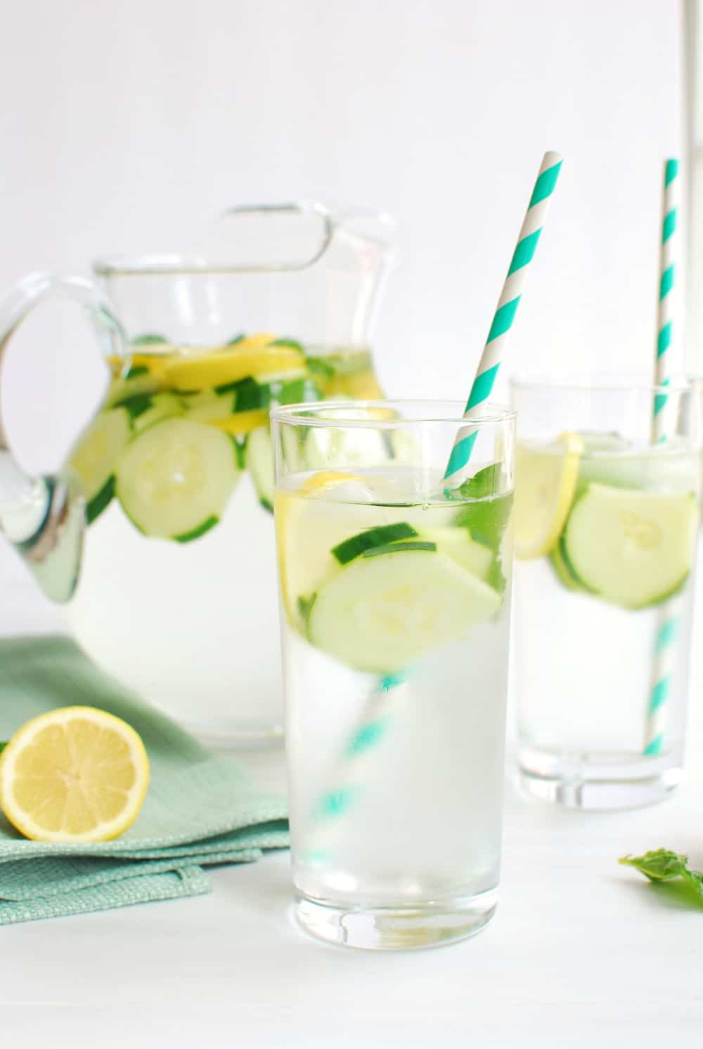 Glass full of infused cucumber lemon mint water