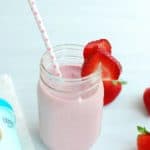 Healthy strawberry milkshake in a mason jar