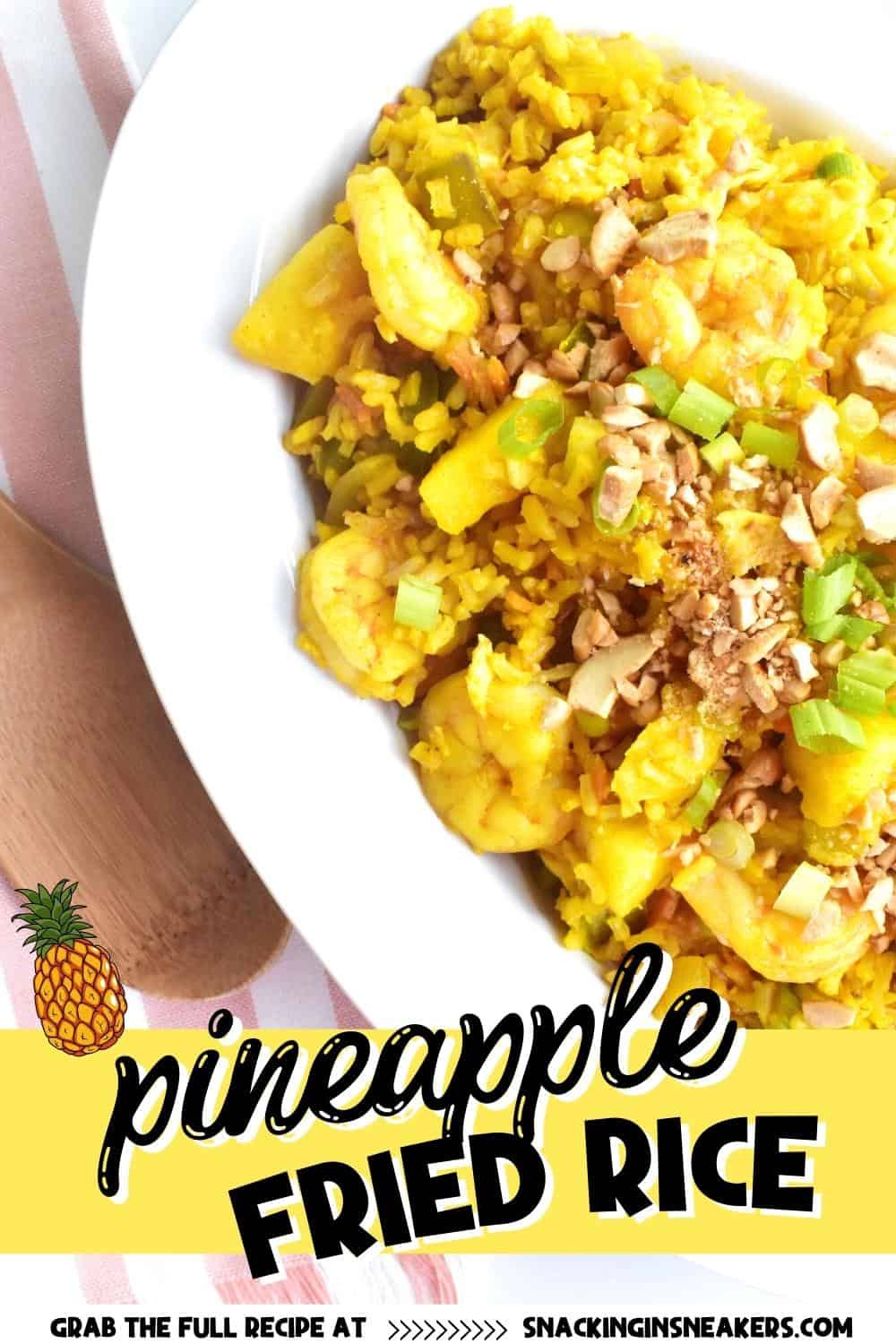 A bowl of pineapple fried rice with a text overlay for Pinterest.