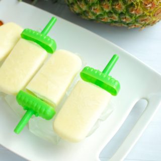 Pina Colada Popsicles on a tray