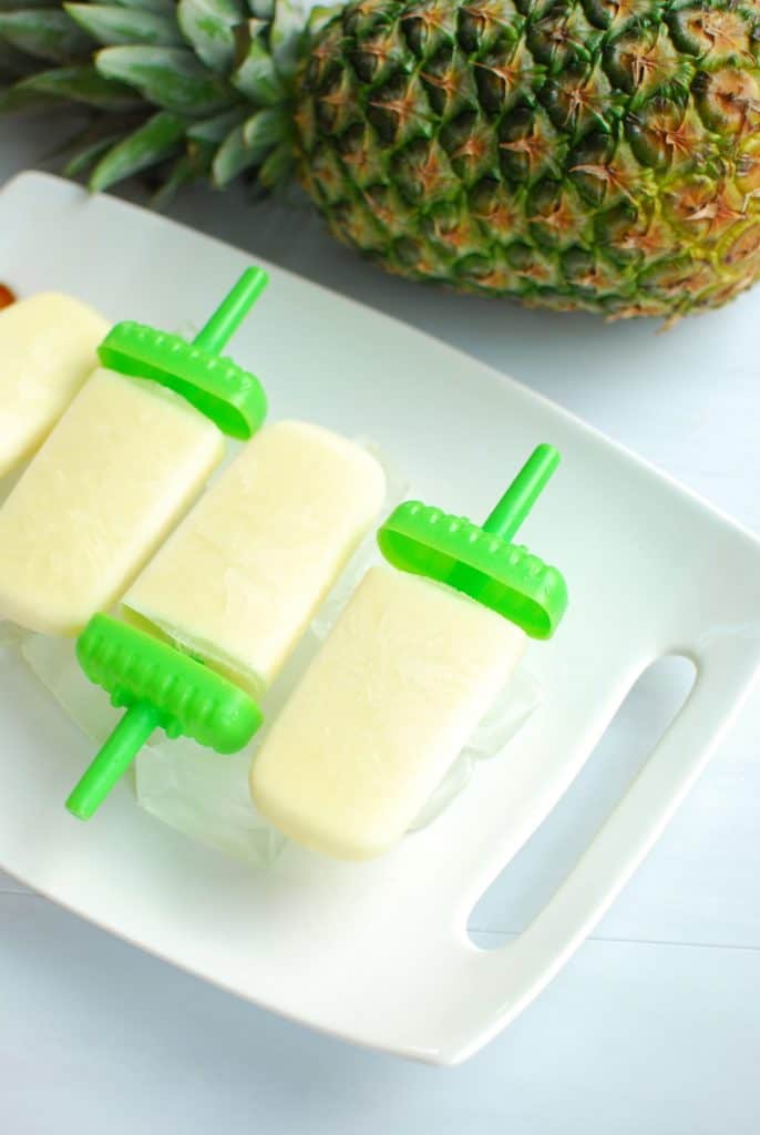 Boozy Pina Colada Popsicles Snacking in Sneakers