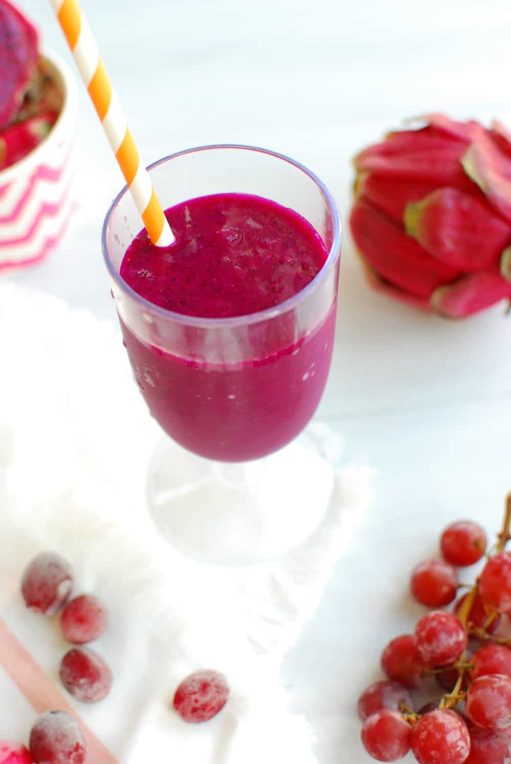 Close up of a pitaya smoothie with grapes and cranberries