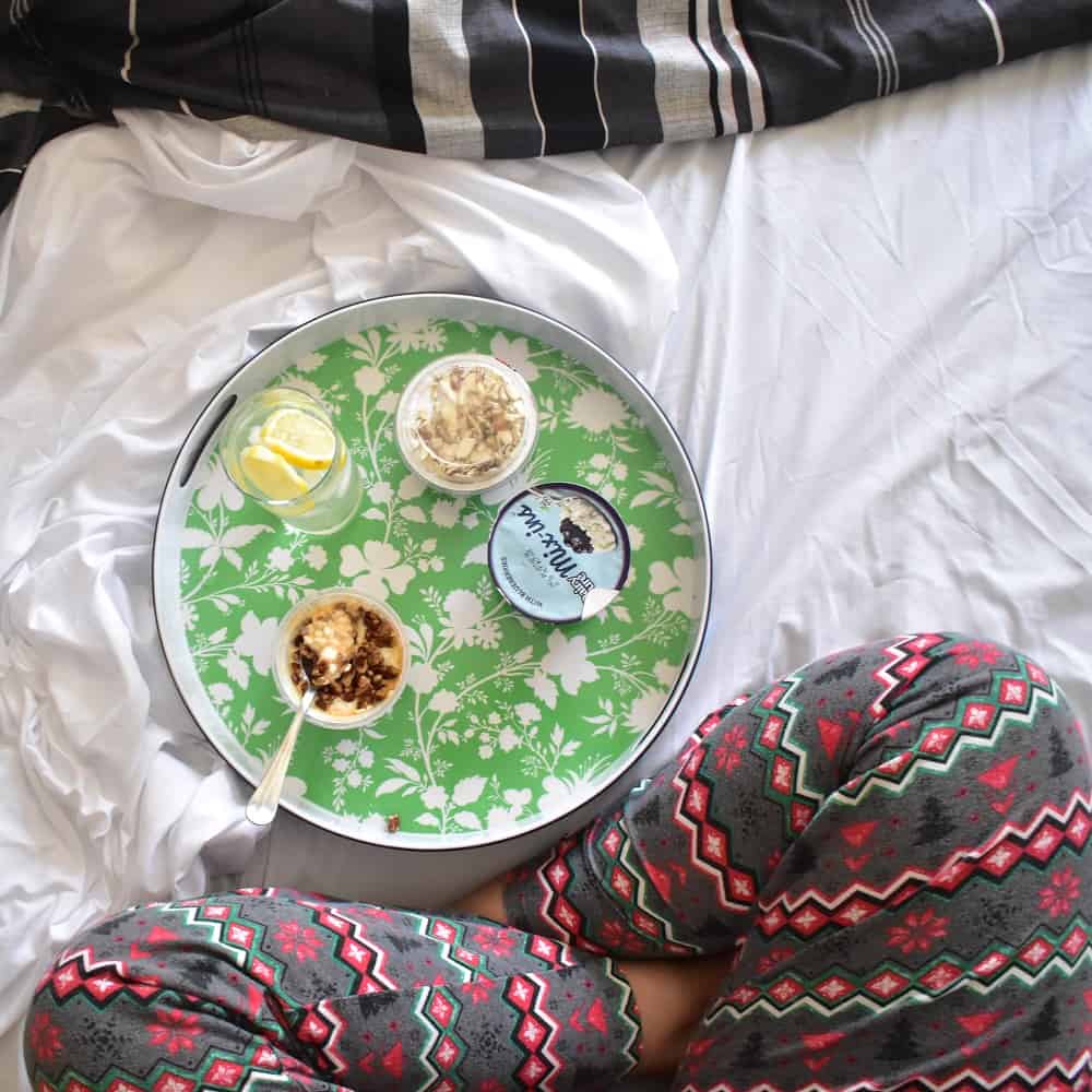 Cottage cheese as a bedtime snack on a bed.