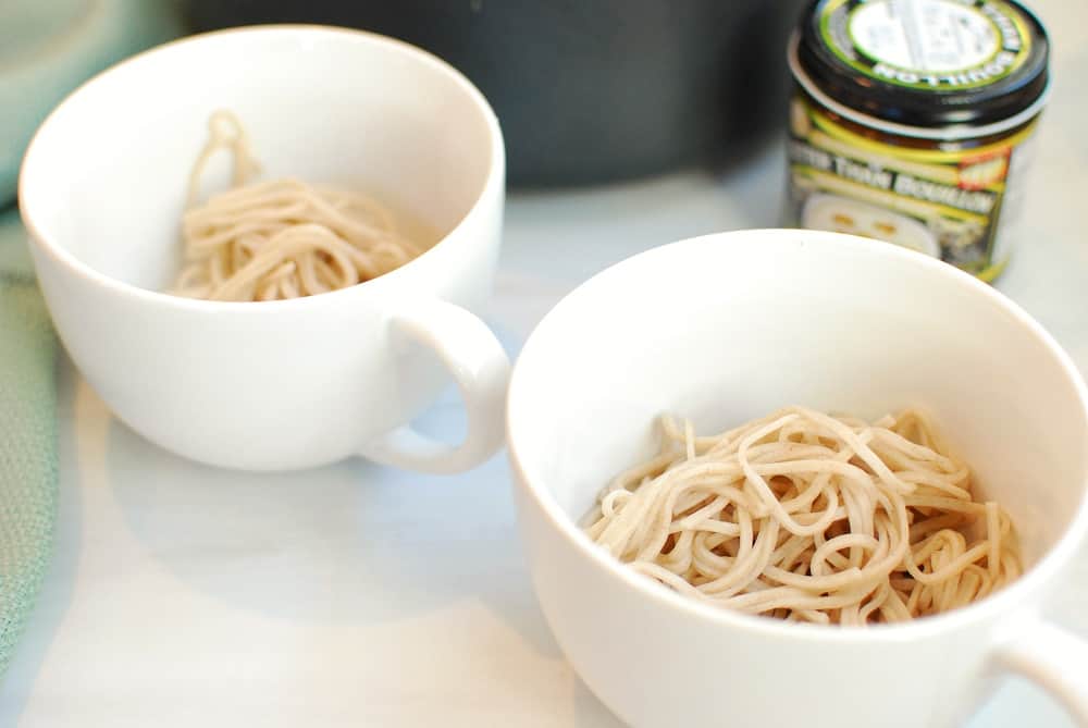 Soba noodles in two soup mugs