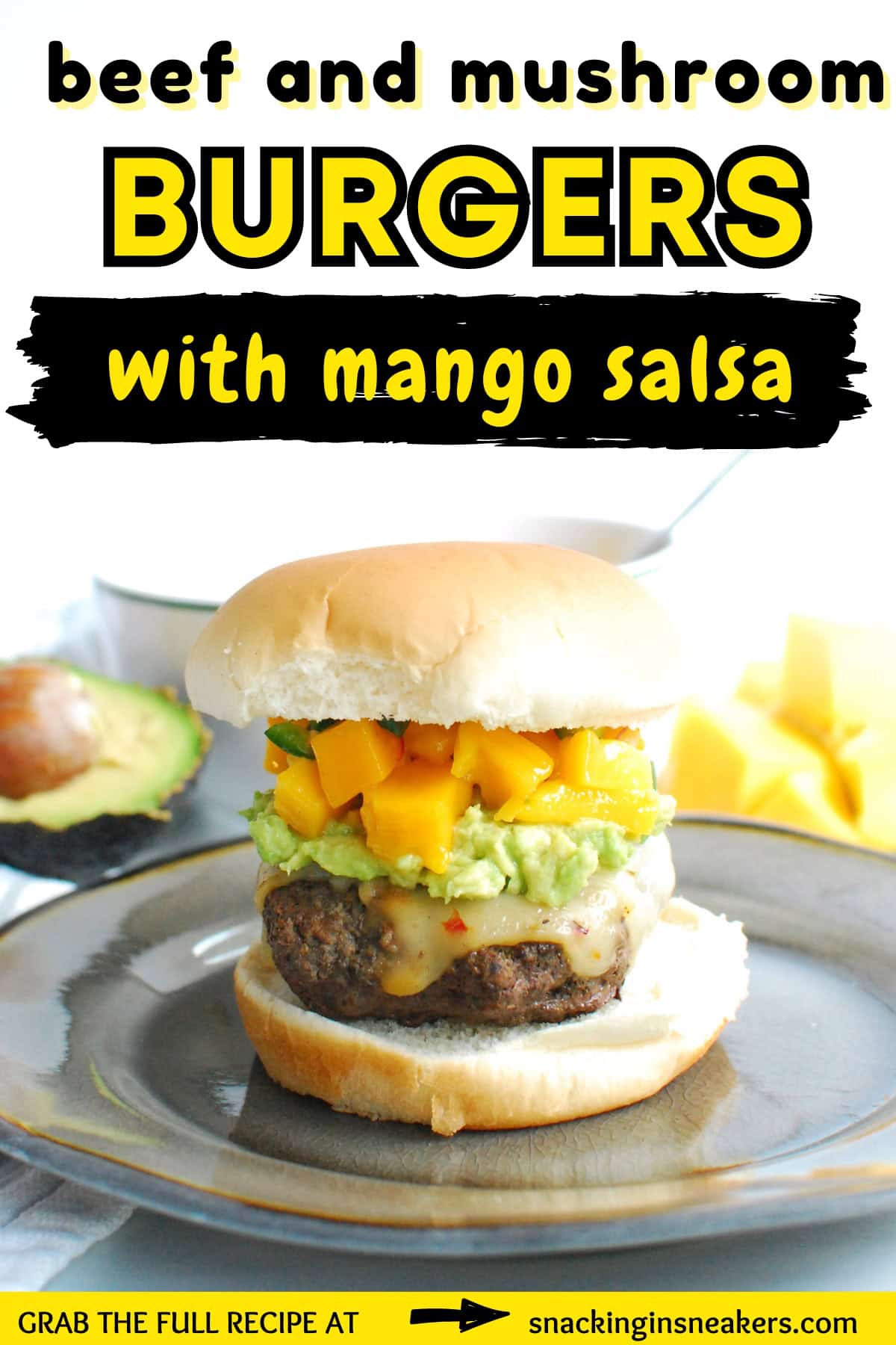 A burger topped with mango salsa on a bun, with a text overlay with the name of the recipe.