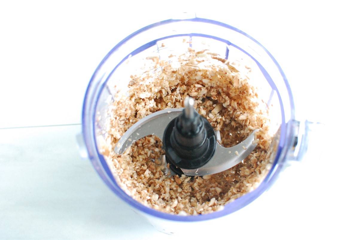 Finely chopped mushrooms in a mini food processor bowl.