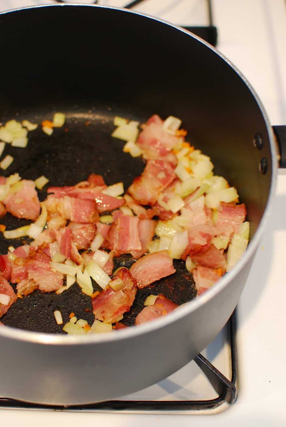 Bacon, onion, and pepper in a large pot