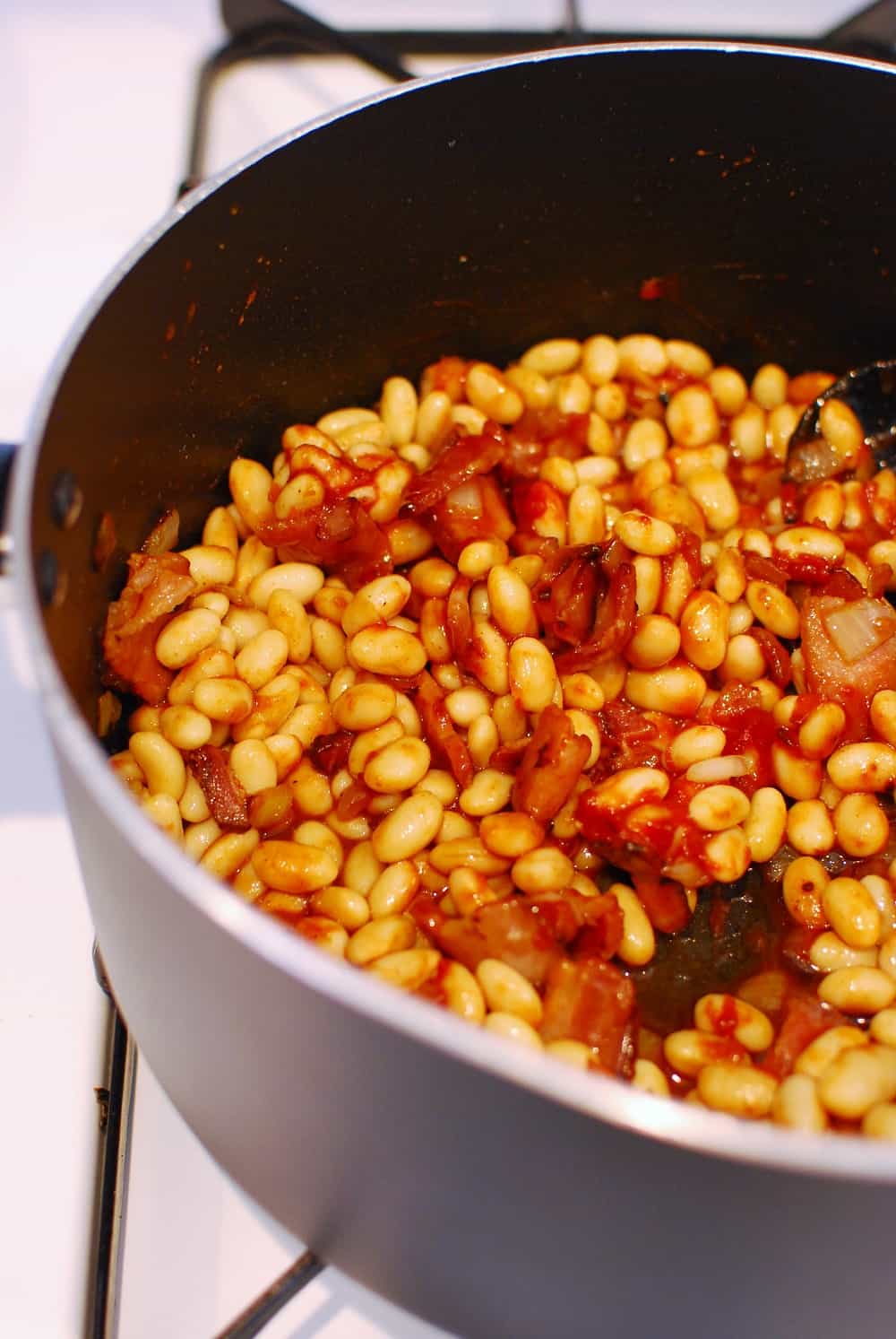 A pot full of ingredients for healthy baked beans