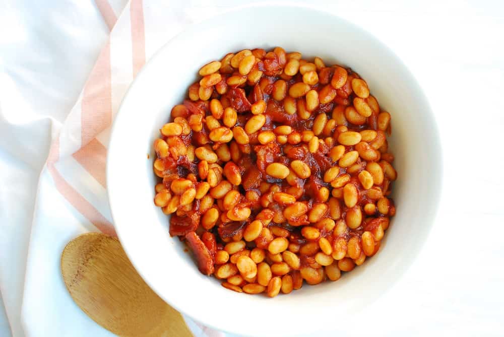 A white bowl full of stovetop baked beans