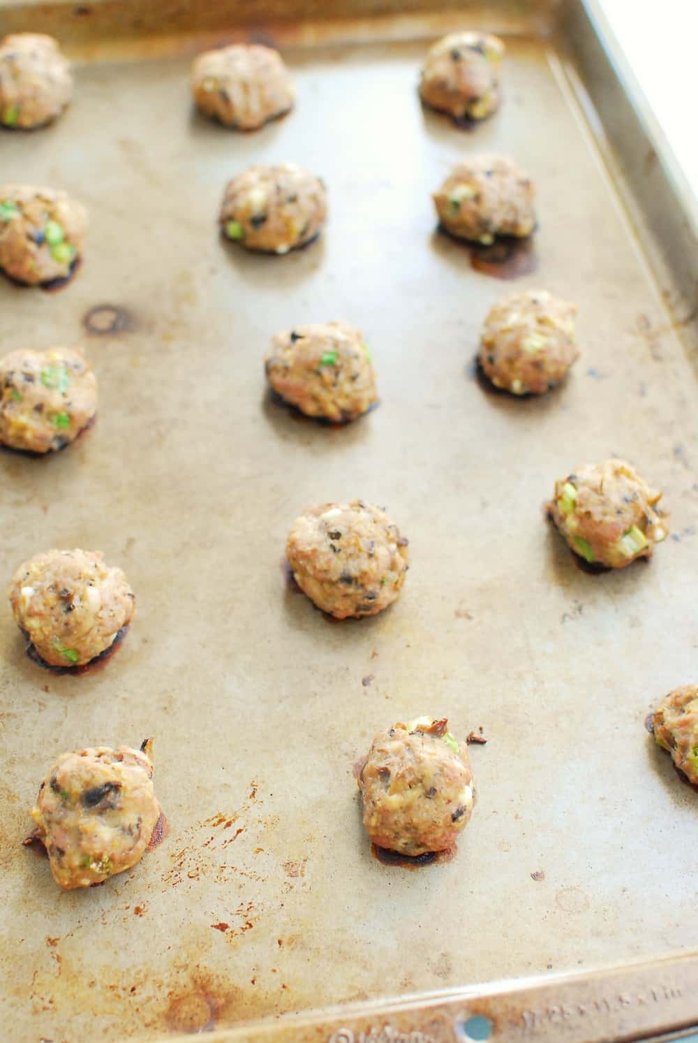 A tray of cooked buffalo meatballs