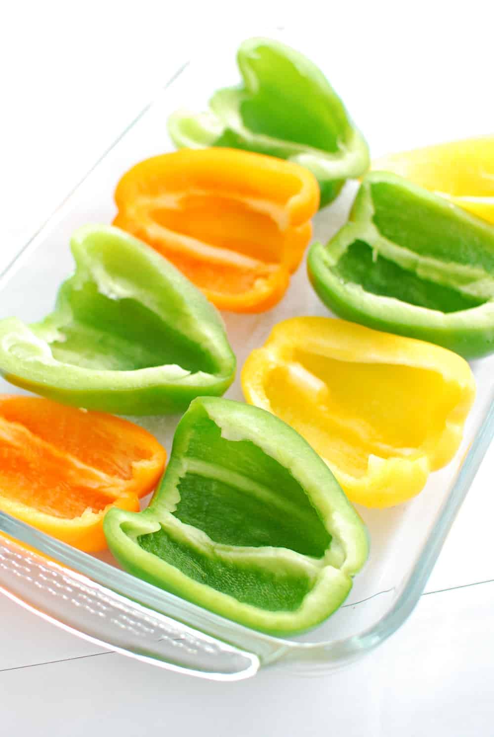 Sliced bell peppers in a casserole dish