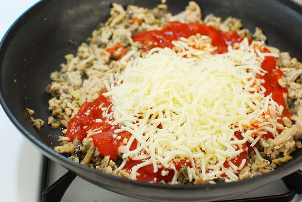 Skillet with ground chicken, mushrooms, marinara, and mozzarella cheese