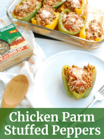 Chicken parm stuffed peppers on a plate and next to a casserole dish of more