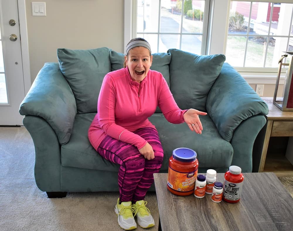 A runner next to a table of supplements