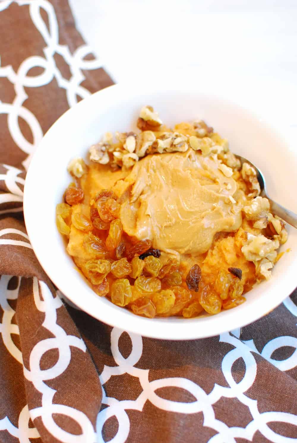 sweet potato breakfast bowl next to a brown napkin