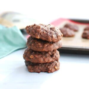 A stack of four double chocolate banana cookies.