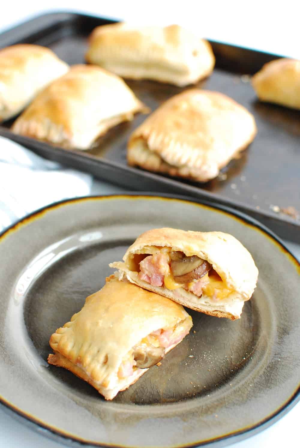 Homemade ham and cheese pockets on a plate