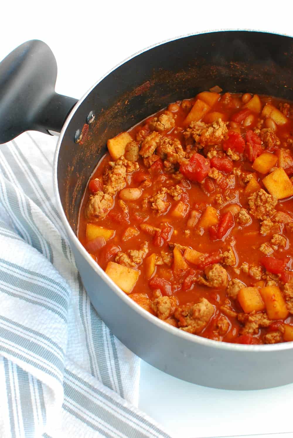 a large pot full of healthy turkey chili made with chipotles and apples