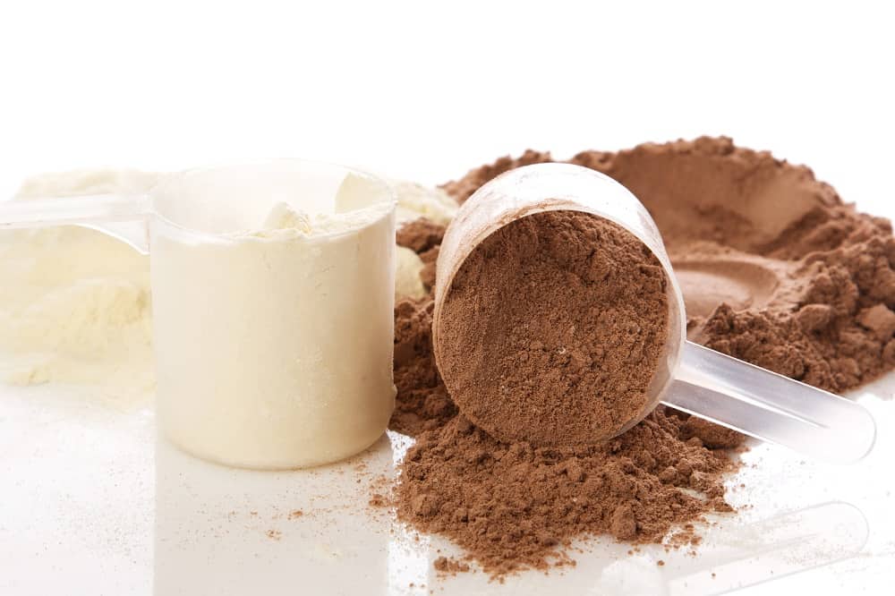 Close up of protein powder and scoops